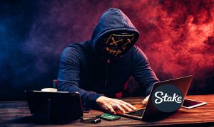Hacker in a hoodie orchestrating Stake Casino cyber attack September 2023